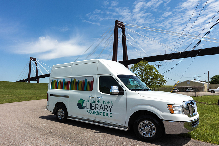Bookmobile parked in front of bridge